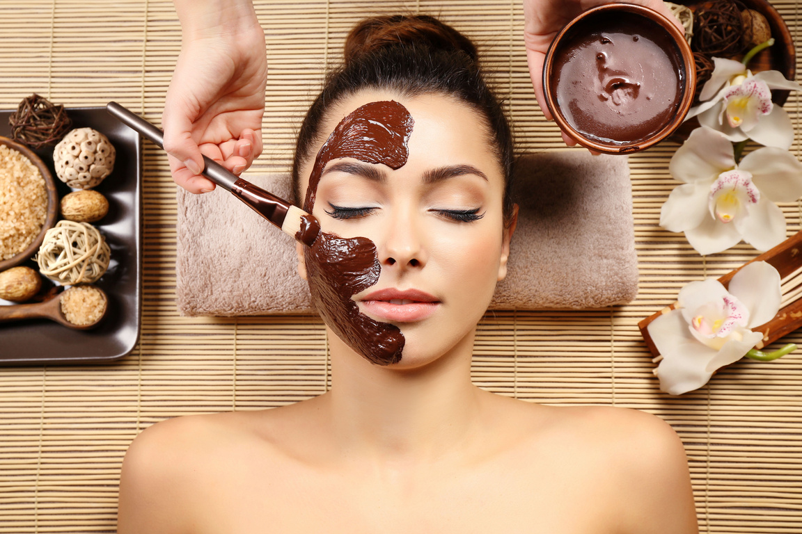 Young Woman Getting Chocolate Facial Massage 